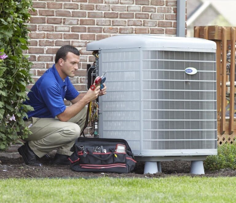 HVAC expert diagnosing an air conditioning problem